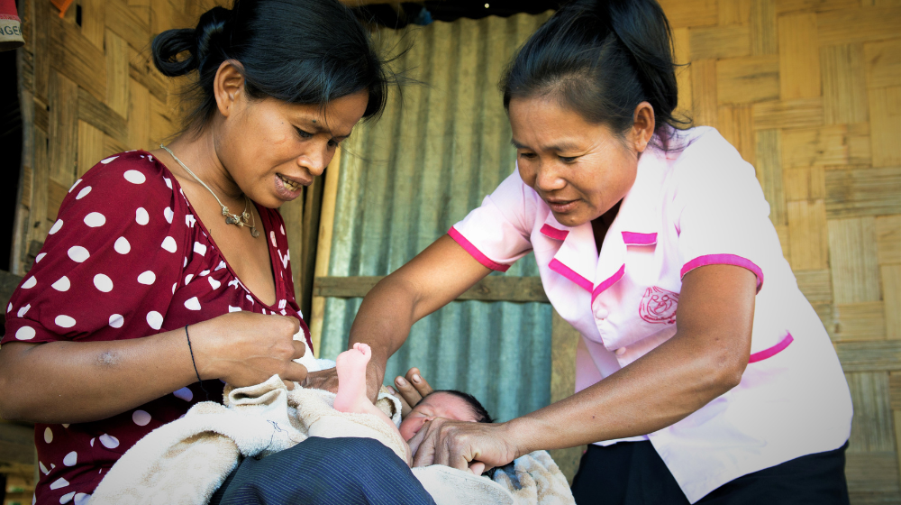 A midwife in Laos helps a mother with her infant. Well-trained midwives can avert roughly two thirds of all maternal and newborn deaths. (Photo credit: UNFPA Laos)