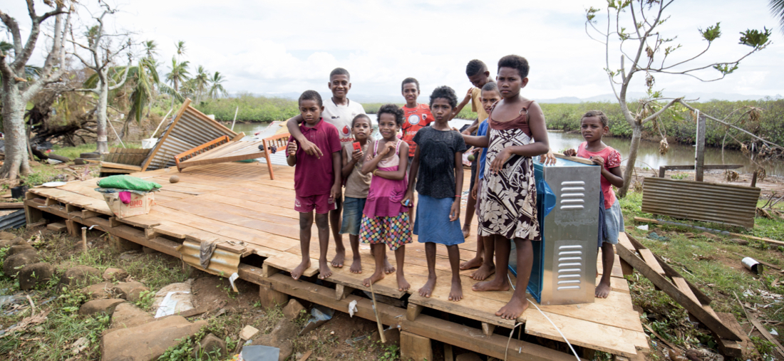 Fiji: Children stand in the remains of their home follwing the destruction of Tropical Cyclone Yasa. ©UNFPA Pacific