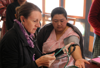 Catherine screens a woman in Bhutan for NCDs
