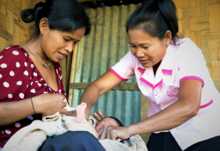 A midwife in Laos helps a mother with her infant. Well-trained midwives can avert roughly two thirds of all maternal and newborn deaths. (Photo credit: UNFPA Laos)