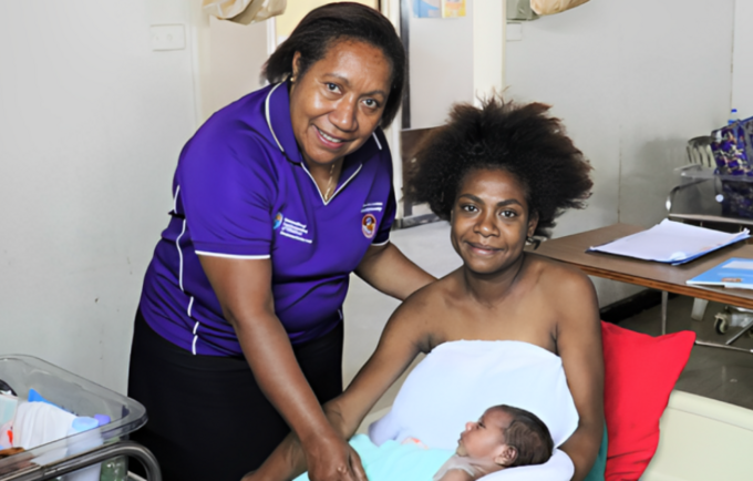 Sr Mary Sitiang celebrates new delivery with healthy mother and baby in Port Moresby General Hospital.