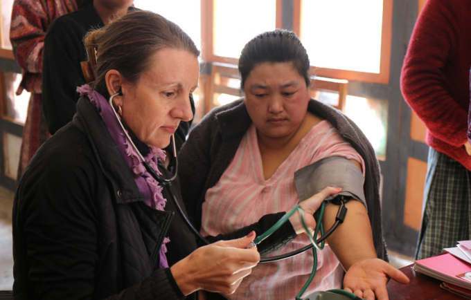 Catherine screens a woman in Bhutan for NCDs