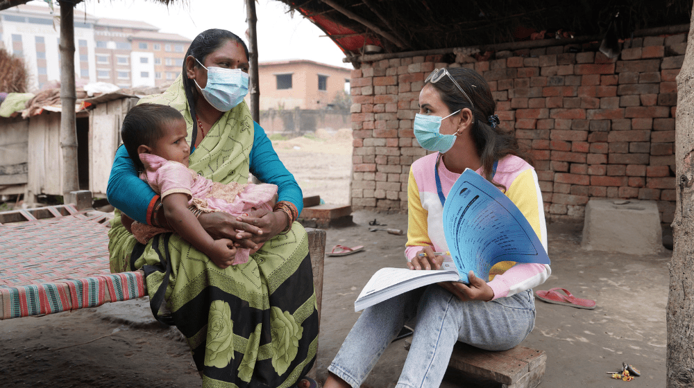Picture shows an enumerator collecting data in Nepal
