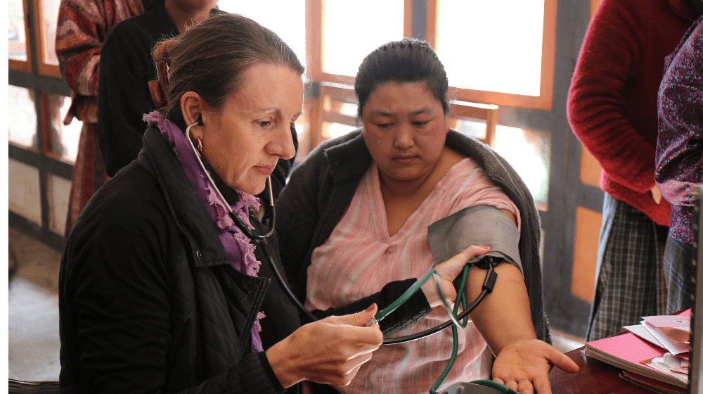 Catherine screens a woman in Bhutan for NCDs