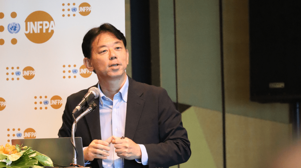 A photo of Dr Rintaro Mori speaking at a UNFPA event