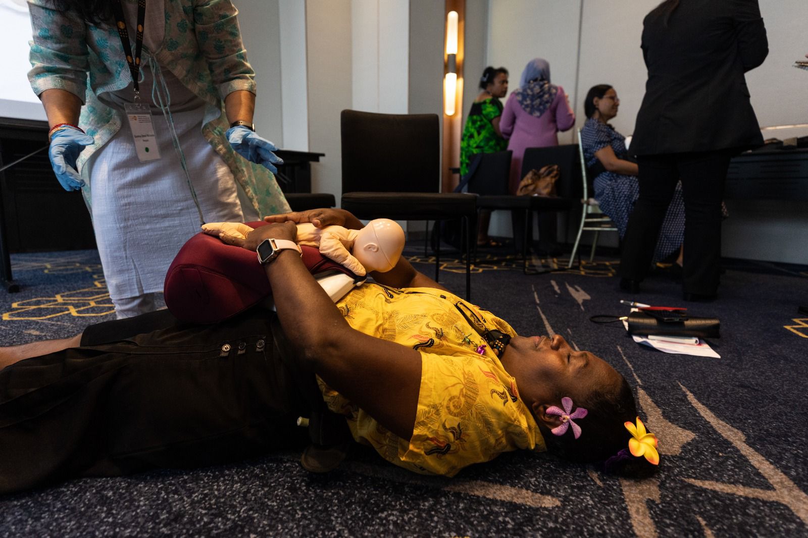 Midwifery educator Ms Cherolyn Polomon from Papua New Guinea uses a ‘Mamabirthie’, a birthing simulator which enables midwifery students to practise manoeuvres and skills for all stages of labour.